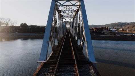 Train Track Bridge during Cloudy Skies · Free Stock Photo