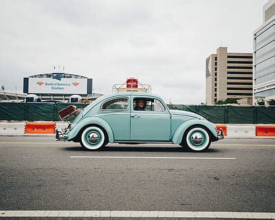 HD Wallpaper Man Standing On Sidewalk In Front Of Blue Volkswagen