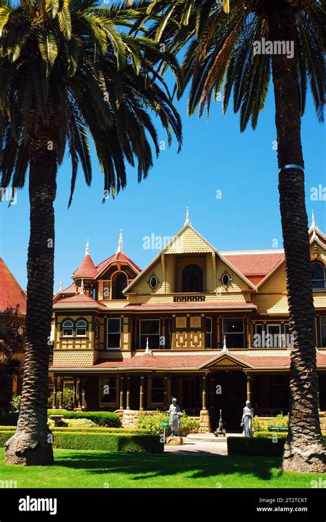 Two Palm Trees Frame The Allegedly Haunted Winchester Mystery House In