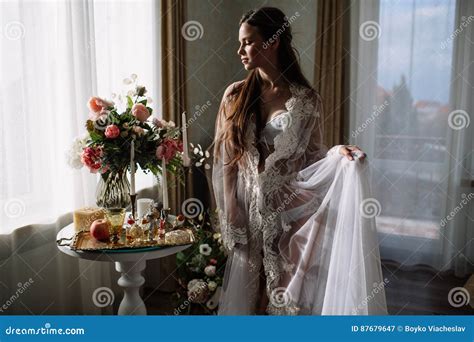 Beautiful Young Sweet Blonde Girl With A Wedding Bouquet In The Hands