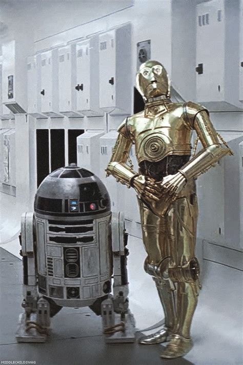 Two Star Wars Characters Standing Next To Each Other