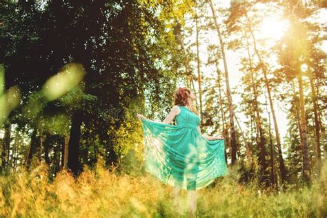 Beautiful Young Woman Wearing Elegant Light Green Dress Standing In The