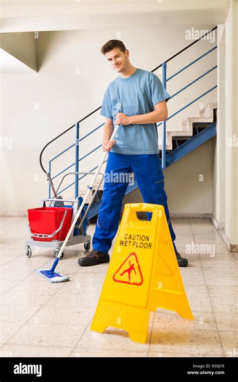 Male Janitor Mopping Floor Stock Photo Alamy