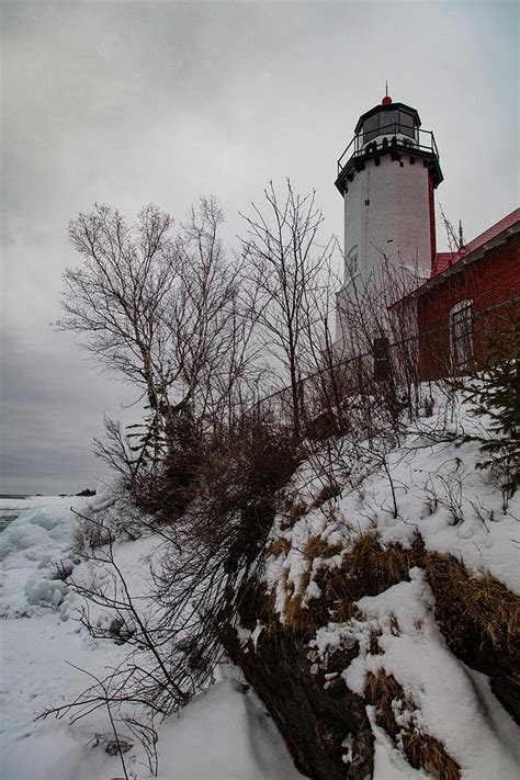 Back View With Trees Of Eagle Harbor Lighthouse In Eagle Harbor