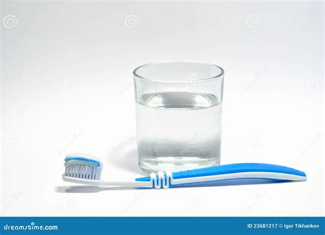 The Glass Of Water And Toothbrush With Toothpaste Stock Image - Image: 23681217