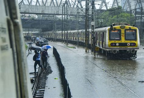 Local trains, Mumbai's lifeline, hit hard as rains pound city