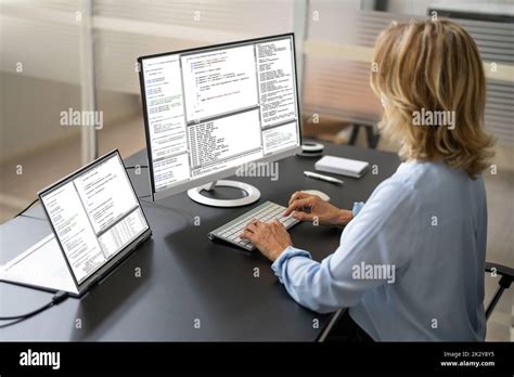 Software Programmer Or Coder Woman Using Office Computer Stock Photo