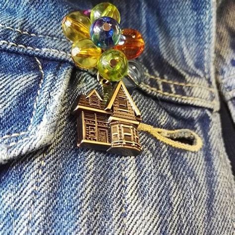 A House Brooch Is Sitting In The Pocket Of Someone S Jeans