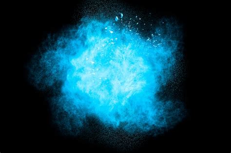 Premium Photo Blue Powder Explosion On Black Background