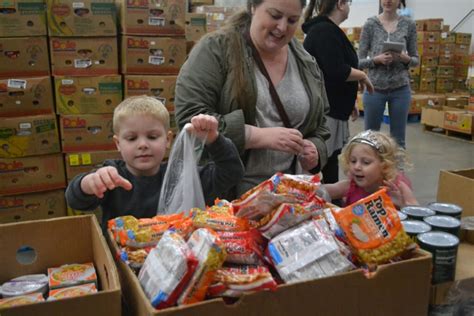 Caring Kids Building Food Bags With The Food Bank Child Care Action