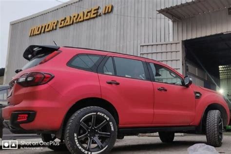 This Modified Ford Endeavour With Matte Red And Black Wrapping Is