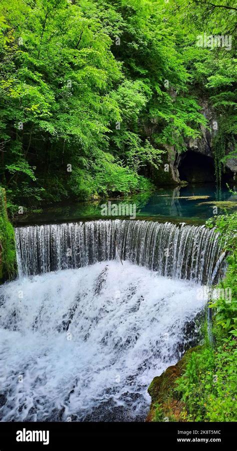 A Vertical Shot Of The Krupajsko Vrelo Turquoise Ponds With Waterfalls