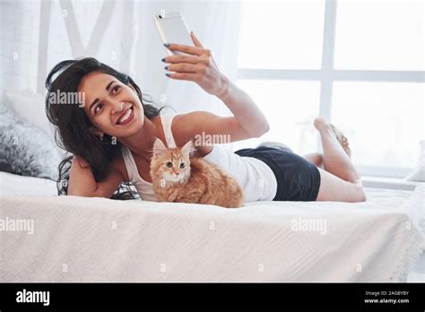 Holding Smarthone And Taking Picture Attractive Blonde Resting On The