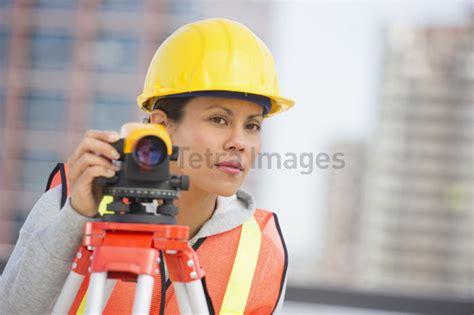 Surveyor Using A Theodolite Instrument Stock Image Tetra Images