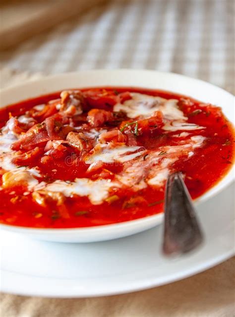 Traditional Ukrainian Russian Tomato Borscht Soup With Sour Cream In A