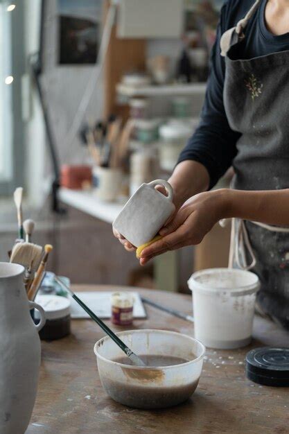 Premium Photo Female Person Enjoys Working With Handmade Crockery