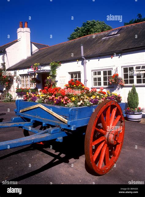 Hampshire Colourful Old Cart Outside A New Forest Pub In The Village