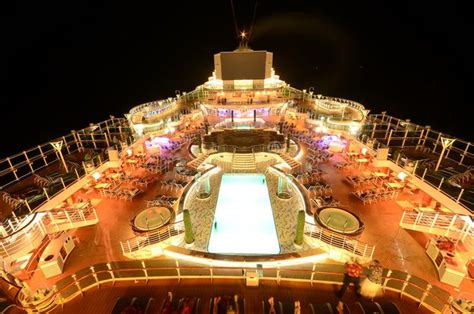 Cruise ship top deck at night. Cruise ship top deck under neon lights ...