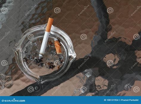 Cigarette in Ashtray Placed on Table Glass Stock Photo - Image of dirty ...