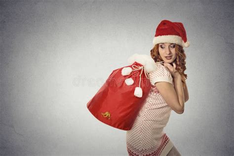 Santa Helper Girl Carrying Big Red Christmas Sack Full Of Ts Stock