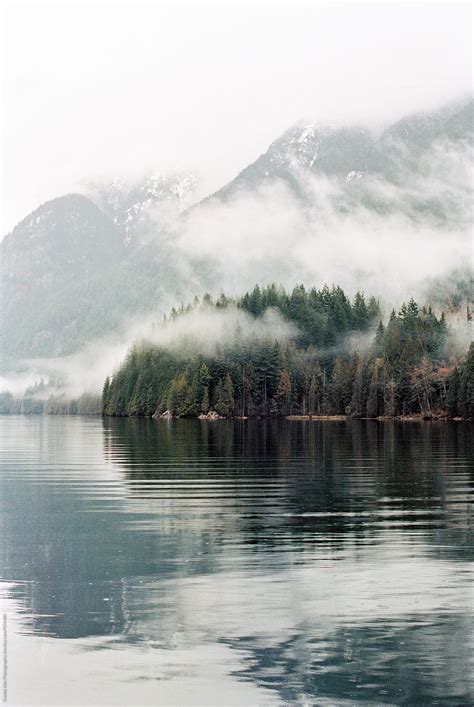 "Foggy Mountain Lake Scene" by Stocksy Contributor "Daniel Kim ...