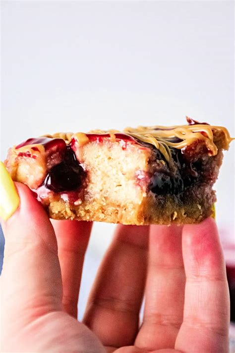 Peanut Butter And Jelly Cheesecake Bars With Vanilla Wafer Crust