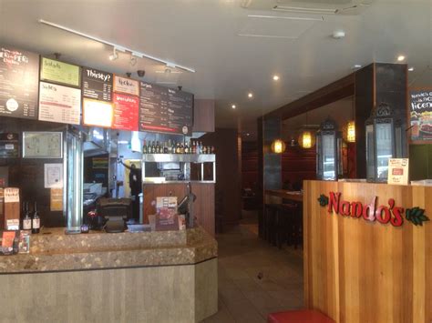 the inside of a restaurant with menus on the wall and wood paneling ...