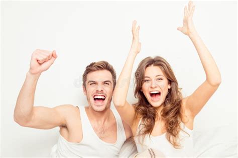 Young Excited Couple In Love At Home Raising Hands Stock Image Image