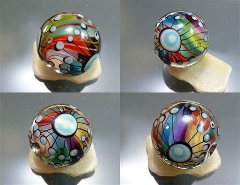 Four Different Images Of Colorful Glass Balls On Display In The Shape