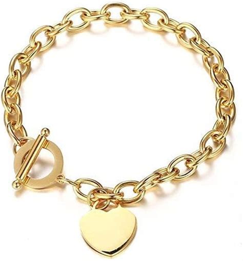 A Gold Bracelet With A Heart Charm On It