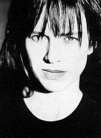 a black and white photo of a woman with bangs