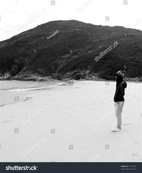 Lonely Girl On The Beach In Black And White Tone Stock Photo 70172482