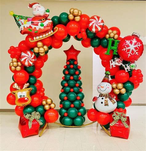 The Balloon Arch Is Decorated With Christmas Decorations