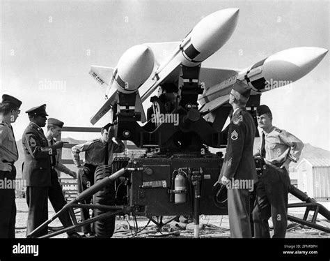 Soldiers of a German anti-aircraft missile battalion are instructed by ...