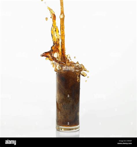 Coke Pouring Down To A Glass Stock Photo Alamy