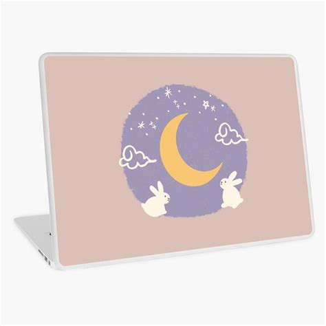 A Laptop With An Image Of Rabbits Sitting On The Moon And Clouds In The Sky