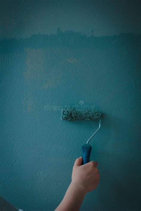 Painting Wall by Aqua Color Paints with Paint Roll. Stock Image - Image of wall, room: 126074685