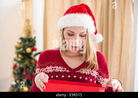 Festive Blonde Opening A Gift Stock Photo Alamy