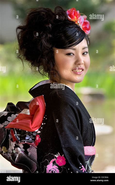 Beautiful 19 Year Old Japanese Girl Wearing Traditional Furisode Long Sleeve Kimono With Spring