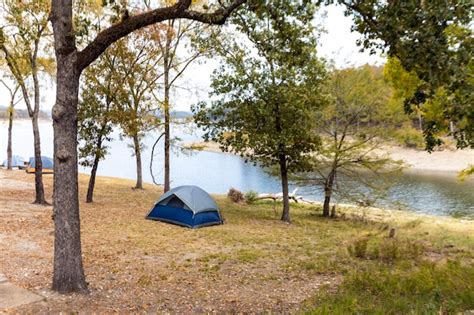 Premium Photo Camping Tents Near A Beautiful Lake Campsite Adventure