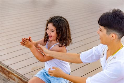 Mother And Daughter Enjoying Summer Together Outside Stock Image