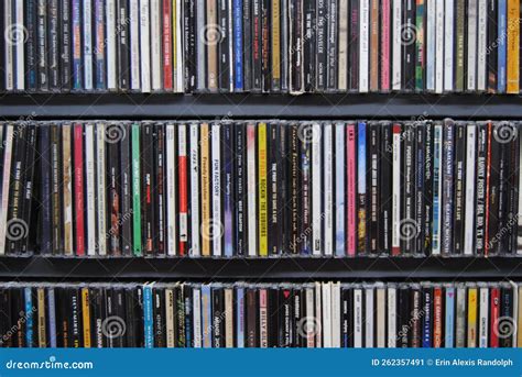 CD Collection, Compact Discs Arranged on Shelves Editorial Photo ...