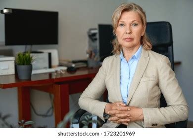 Portrait Mature Female Boss Working Office Stock Photo 1723201969