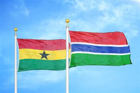 Ghana And Gambia Two Flags On Flagpoles And Blue Sky Stock Image