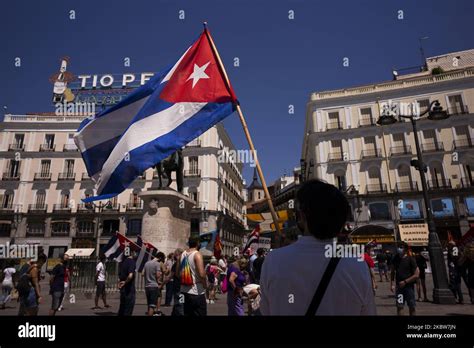 Protesters With Cuban Flags During The Demonstration With The Slogan