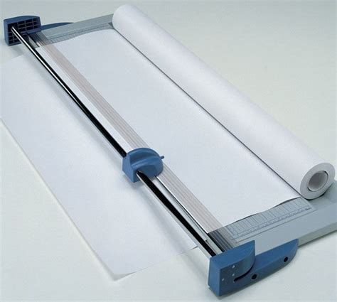 A Piece Of White Paper Is Being Held By A Machine