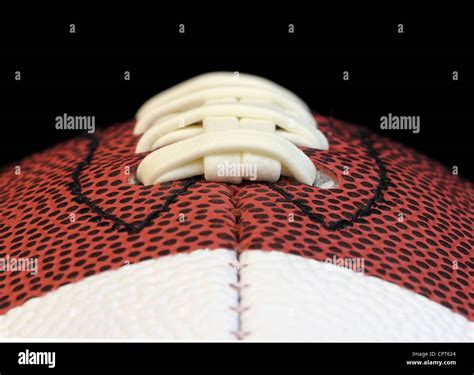 Edge On Macro Of A Football Threads Isolated On Black Stock Photo Alamy