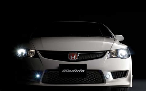 Download The Iconic Honda Logo On A Sleek Black Background