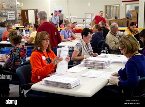 Ada County Elections workers prepare ballots for scanning and ...