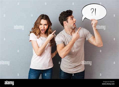 Portrait Of A Young Angry Couple Having An Argument While Standing And